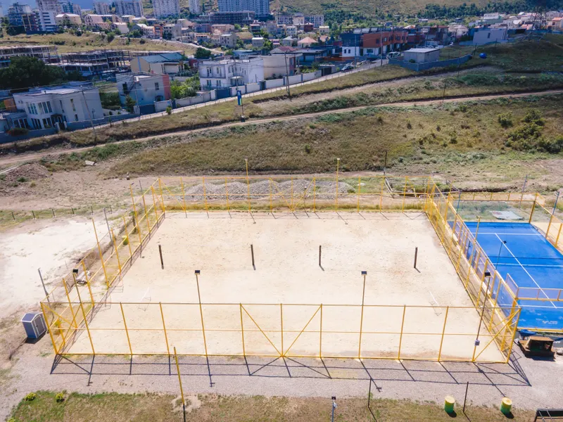 Beach volleyball and padel courts side by side